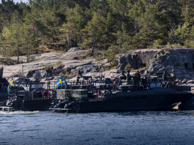 VÄRMDÖ, SWEDEN - JUNE 11: Swedish and Finnish soldiers perform naval simulation exercis