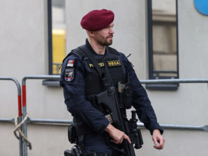 An armed police officer patrols outside the OPEC Secretariat building ahead of the 33rd meeting of the Organization of Petroleum Exporting Countries (OPEC) and non-OPEC countries in Vienna, Austria, on Wednesday, Oct. 5, 2022. OPEC+ is considering its biggest production cut since 2020 as it tries to stabilize oil prices, …