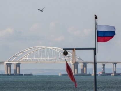 A view taken on October 14, 2022 shows the Kerch Bridge that links Crimea to Russia, near Kerch, which was hit by a blast on October 8, 2022. - The symbolic bridge inaugurated by Russia's President Vladimir Putin in 2018, is logistically crucial for Moscow, a vital transport link for …