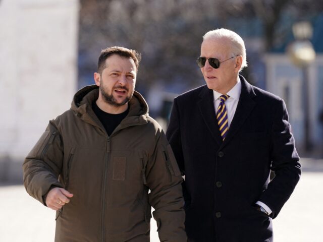 TOPSHOT - US President Joe Biden (R) walks next to Ukrainian President Volodymyr Zelensky (L) as he arrives for a visit in Kyiv on February 20, 2023. - US President Joe Biden made a surprise trip to Kyiv on February 20, 2023, ahead of the first anniversary of Russia's invasion …