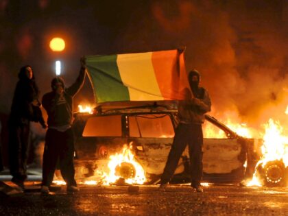 Cars burn during Nationalist rioting in the Ardoyne area of North Belfast, Northern Irelan