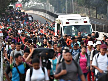 24 April 2023, Mexico, Obregon: Numerous migrants walk along the side of a highway heading north. The caravan started on Sunday morning in the city of Tapachula. Their initial destination is the capital Mexico City, almost 880 kilometers away. Some activists had announced that they would continue to the U.S. …