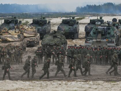NOWA DEBA, POLAND - MAY 06, 2023: Participants of a high-intensity training session, seen at the end of the exercise at the Nowa Deba training ground on May 06, 2023 in Nowa Deba, Poland. Anakonda-23 is the highlight of the Polish Army's training calendar this year. Soldiers from various units, …