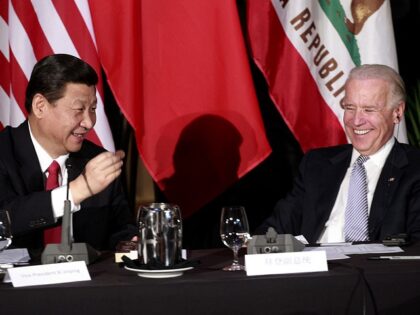 LOS ANGELES, CA - FEBRUARY 17: Chinese Vice President Xi Jinping (L) shows U.S. Vice Presi
