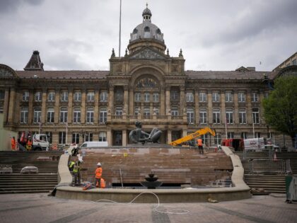 BIRMINGHAM, ENGLAND - APRIL 19: Workers renovate The River fountain outside Birmingham City Council House. The statue is known by locals as the 'The Floozie in the Jacuzzi', on April 19, 2022 in Birmingham, England. The Conservative, Labour and Liberal Democratic parties are vying for control of Birmingham City Council …