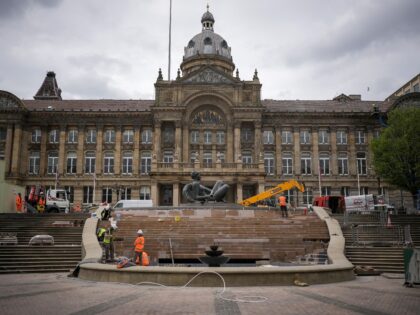 BIRMINGHAM, ENGLAND - APRIL 19: Workers renovate The River fountain outside Birmingham Cit