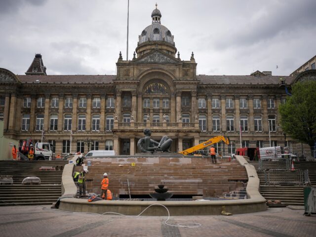 BIRMINGHAM, ENGLAND - APRIL 19: Workers renovate The River fountain outside Birmingham Cit