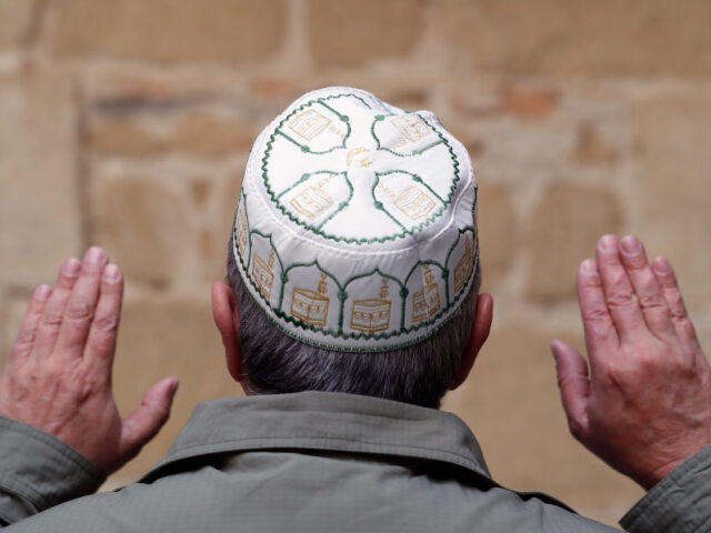 Back view of a muslim man praying with a kufi cap on head. Spain. (Photo by: Pascal Deloch