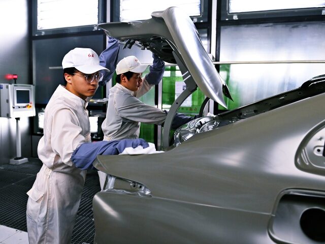 CHANGCHUN, CHINA - JULY 05: Employees work on the assembly line of new energy vehicles (NEVs) at a workshop of China FAW Group's Hongqi Fanrong Plant on July 5, 2023 in Changchun, Jilin Province of China. (Photo by Zhang Yao/China News Service/VCG via Getty Images)