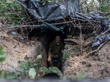 DONETSK OBLAST, UKRAINE - AUGUST 21: Ukrainian soldier waits on guard in a trench at their fighting position in the direction of Bakhmut frontline as the Russia-Ukraine war continues in Donetsk Oblast, Ukraine on August 21, 2023. (Photo by Diego Herrera Carcedo/Anadolu Agency via Getty Images)