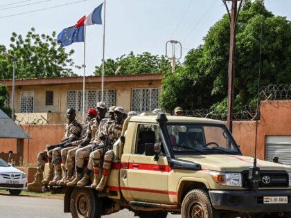 A patrol of the Niger national Police drives past the French Embassy in Niamey on August 28, 2023. Thousands of people demonstrated on August 27, 2023 in Niger in support of last month's coup, a few hours before the deadline given to France's ambassador in an ultimatum to leave the …