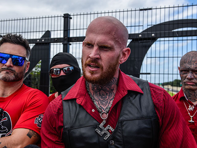 Christopher "Hammer" Pohlhaus (R) leads a rally with neo-Nazi groups Blood Tribe