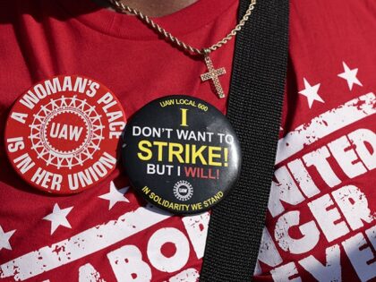 A United Auto Workers (UAW) supporter during a Labor Day parade in Detroit, Michigan, US, on Monday, Sept. 4, 2023. The UAW's 150,000 members are threatening a strike on General Motors, Ford Motor Co. and Stellantis NV, maker of the Jeep and Chrysler brands, if a deal with Detroit's big …