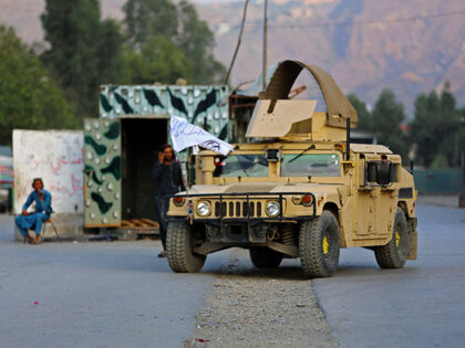 A humvee (HMMWV) vehicle is seen near the closed gates of Torkham border crossing between