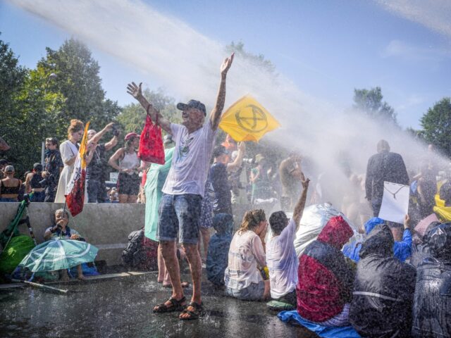 The police use water cannon against climate activists of "Extinction Rebellion" movement,