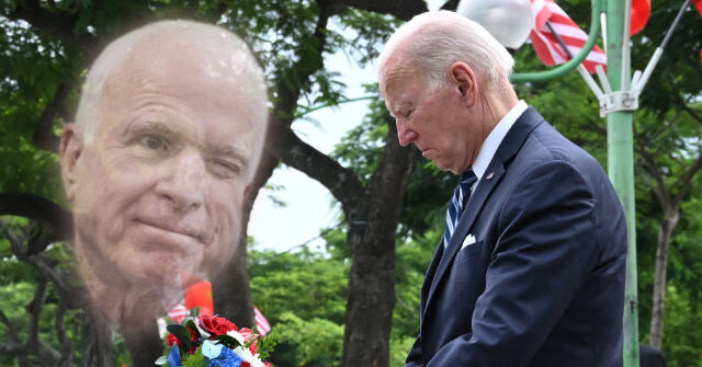 President Joe Biden Kisses John McCain's Memorial in Vietnam
