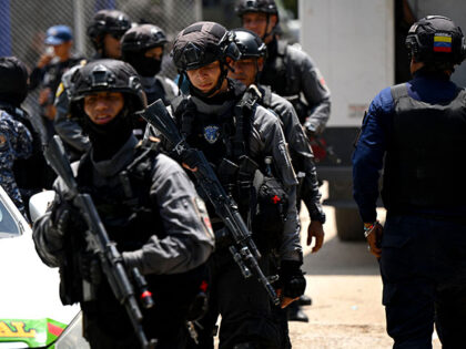 Special forces take a position outside the Tocoron prison a day after authorities seized c