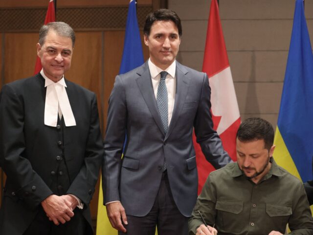 Ukrainian President Volodymyr Zelensky, Canadian Prime Minister Justin Trudeau, Speaker of the House of Commons Anthony Rota (L) and Speaker of the Senate Raymonde Gagne (R) take part in a signing ceremony on Parliament Hill in OttawaOttawa, Canada, on September 22, 2023. (Photo by Patrick Doyle / POOL / AFP) …