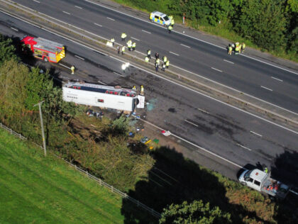 Emergency services at the scene of a coach crash on the M53 motorway, between junction 5 a