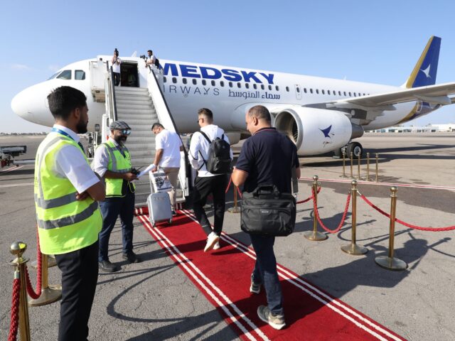 Passengers board the first flight from Tripoli to Rome on September 30, 2023 after the Ita