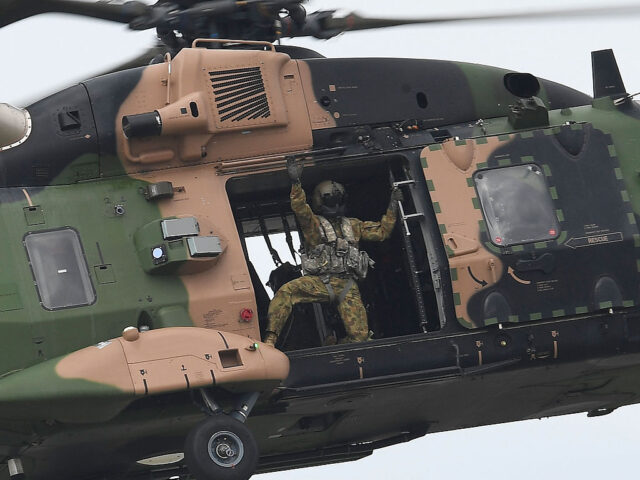 TOWNSVILLE, AUSTRALIA - OCTOBER 15: A loadmaster from an Australian Army MRH90 Taipan hel