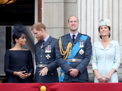 LONDON, ENGLAND - JULY 10: (L-R) Meghan, Duchess of Sussex, Prince Harry, Duke of Sussex, Prince William, Duke of Cambridge and Catherine, Duchess of Cambridge watch the RAF flypast on the balcony of Buckingham Palace, as members of the Royal Family attend events to mark the centenary of the RAF …