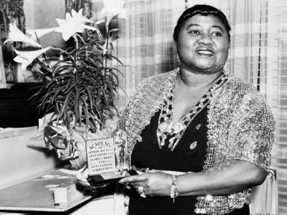 Portrait of American actress Hattie McDaniel (1892 - 1952) holding her Academy Award from