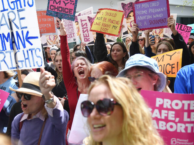 Abortion rights advocates rally to protest new restrictions on abortions, May 21, 2019, in