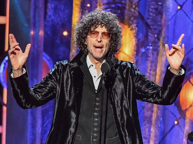 CLEVELAND, OH - APRIL 14: Howard Stern inducts Bon Jovi on stage during the 33rd Annual Ro