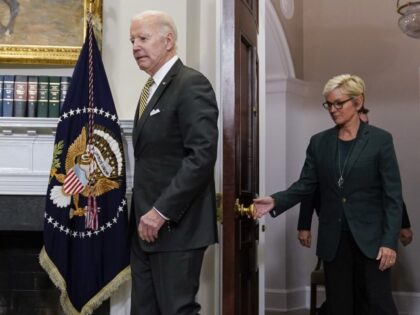President Joe Biden and Energy Secretary Jennifer Granholm arrive for an event in the Roos
