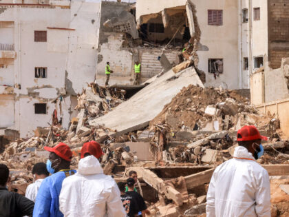 Rescue teams assist in relief work in Libya's eastern city of Derna September 17, 2023 following deadly flash floods. A week after a tsunami-sized flash flood devastated the Libyan coastal city of Derna, sweeping thousands to their deaths, the international aid effort to help the grieving survivors slowly gathered pace. …