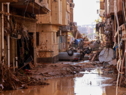TOPSHOT - Overturned cars lay among other debris caused by flash floods in Derna, eastern Libya, on September 11, 2023. Flash floods in eastern Libya killed more than 2,300 people in the Mediterranean coastal city of Derna alone, the emergency services of the Tripoli-based government said on September 12. (Photo …