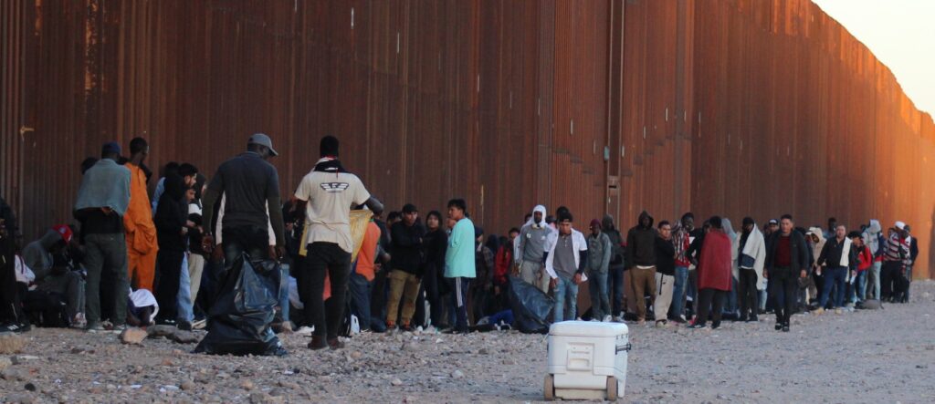 Migrants from many nations gather along border wall in Arizona. (Randy Clark/Breitbart Texas)
