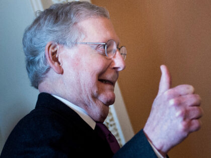 Senate Majority Leader Mitch McConnell (R-KY) gives a thumbs up as he walks from a vote on Capitol Hill after the senate voted to advance a bill financing the U.S government January 22, 2018 in Washington, DC. (Photo by Brendan Smialowski / AFP) (Photo by BRENDAN SMIALOWSKI/AFP via Getty Images)