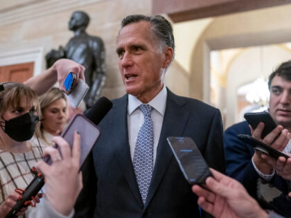 FILE - Sen. Mitt Romney, R-Utah, is surrounded by reporters as he arrives at the historic Old Senate Chamber at the Capitol in Washington, Nov. 16, 2022. In 2024 Romney will face his first Senate reelection bid, if he chooses to run. Romney remains popular with many residents in Utah …