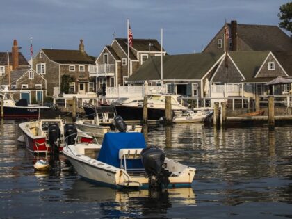 Evening light falls on boats as they bob in the harbor of Nantucket, Massachusetts on Aug.