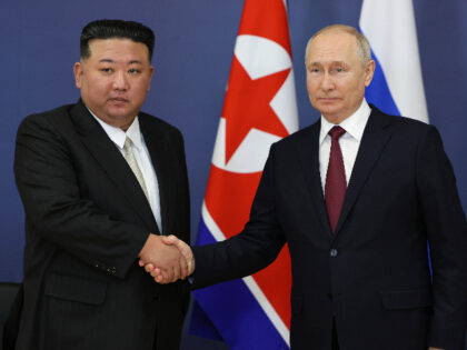 Russian President Vladimir Putin, right, and North Korea's leader Kim Jong Un shake hands during their meeting at the Vostochny cosmodrome outside the city of Tsiolkovsky, about 200 kilometers (125 miles) from the city of Blagoveshchensk in the far eastern Amur region, Russia, on Wednesday, Sept. 13, 2023. (Vladimir Smirnov, …