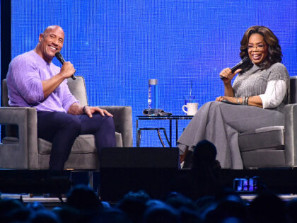 ATLANTA, GEORGIA - JANUARY 25: (EXCLUSIVE COVERAGE) Dwayne Johnson and Oprah Winfrey onstage during Oprah's 2020 Vision: Your Life in Focus Tour presented by WW (Weight Watchers Reimagined) at State Farm Arena on January 25, 2020 in Atlanta, Georgia. (Photo by Paras Griffin/Getty Images for Oprah)