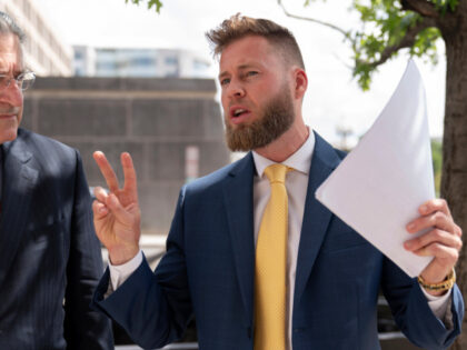 Infowars host Owen Shroyer, accompanied by his attorney Norm Pattis, speaks to reporters outside the E. Barrett Prettyman U.S. Federal Courthouse, Tuesday, Sept. 12, 2023 in Washington. Shroyer was sentenced on Tuesday to two months behind bars for joining the mob's riot at the U.S. Capitol. Prosecutors said Shroyer “helped …