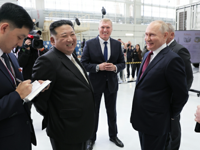 North Korea's Kim Jong-un laughs with Russian leader Vladimir Putin during a visit to far-east Russia on September 13, 2023.