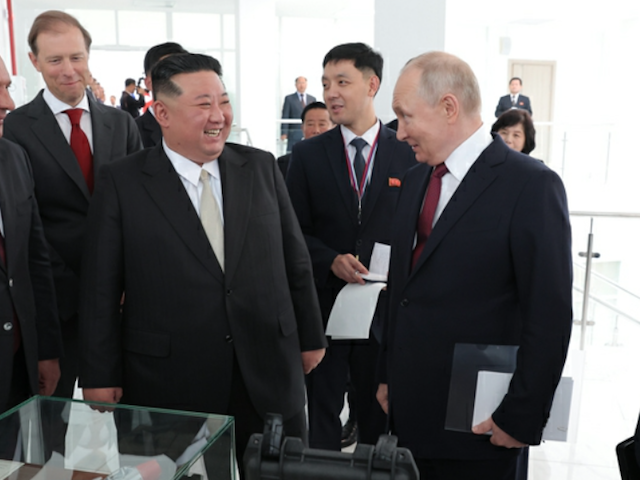 North Korea's Kim Jong-un laughs with Russian leader Vladimir Putin during a visit to far-east Russia on September 13, 2023.