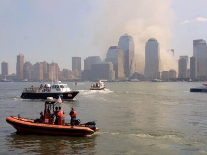 Boats with medical personnel, police and volunteers ply the Hudson River at Jersey City, N