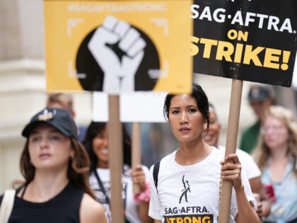 NEW YORK, NEW YORK - AUGUST 24: Marissa Carpio joins SAG-AFTRA members as they maintain picket lines in front of Netflix on August 24, 2023 in New York City. Members of SAG-AFTRA and WGA (Writers Guild of America) have both walked out in their first joint strike against the studios …