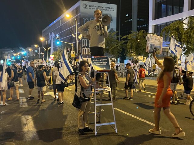 A left-wing activist protests the occupation of territory the Palestinians claim as their