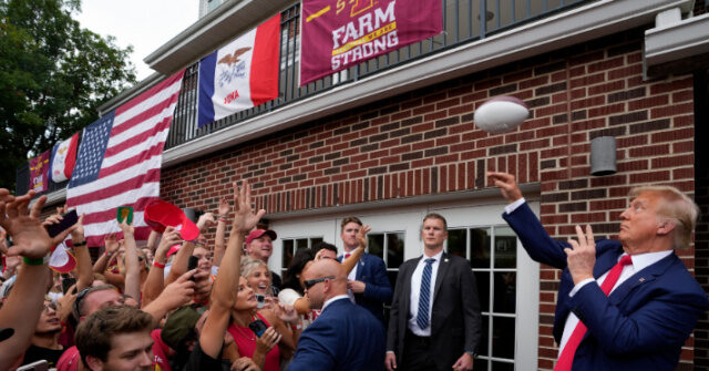 NextImg:Trump Rocks Iowa-Iowa State Game: Throws Footballs into Frat Crowd