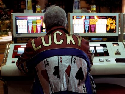 a gambler at slot machine
