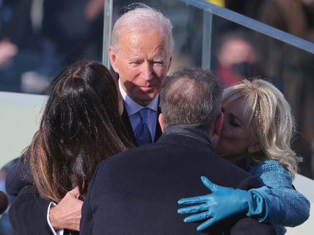 WASHINGTON, DC - JANUARY 20: President Joe Biden and first lady Jill Biden hug Hunter Bide