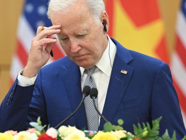 US President Joe Biden gestures as Vietnam's Communist Party General Secretary Nguyen Phu