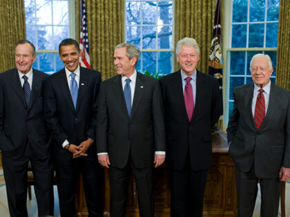 President George W. Bush (C) meets with former President George H.W. Bush (L), President-elect Barack Obama (2nd L), former President Bill Clinton (2nd R) and former President Jimmy Carter (R) in the Oval Office of the White House in Washington DC. (Photo by Brooks Kraft LLC/Corbis via Getty Images)