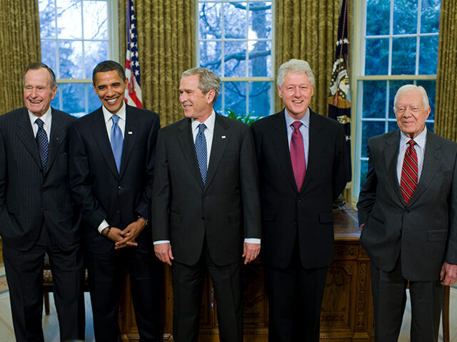 President George W. Bush (C) meets with former President George H.W. Bush (L), President-e